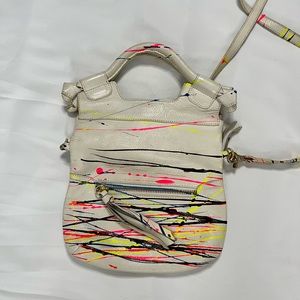 Foley + Corinna cross body bag. Magnetic closure and folds over